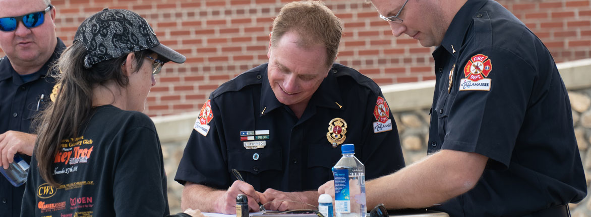 Firefighter teaching civilians